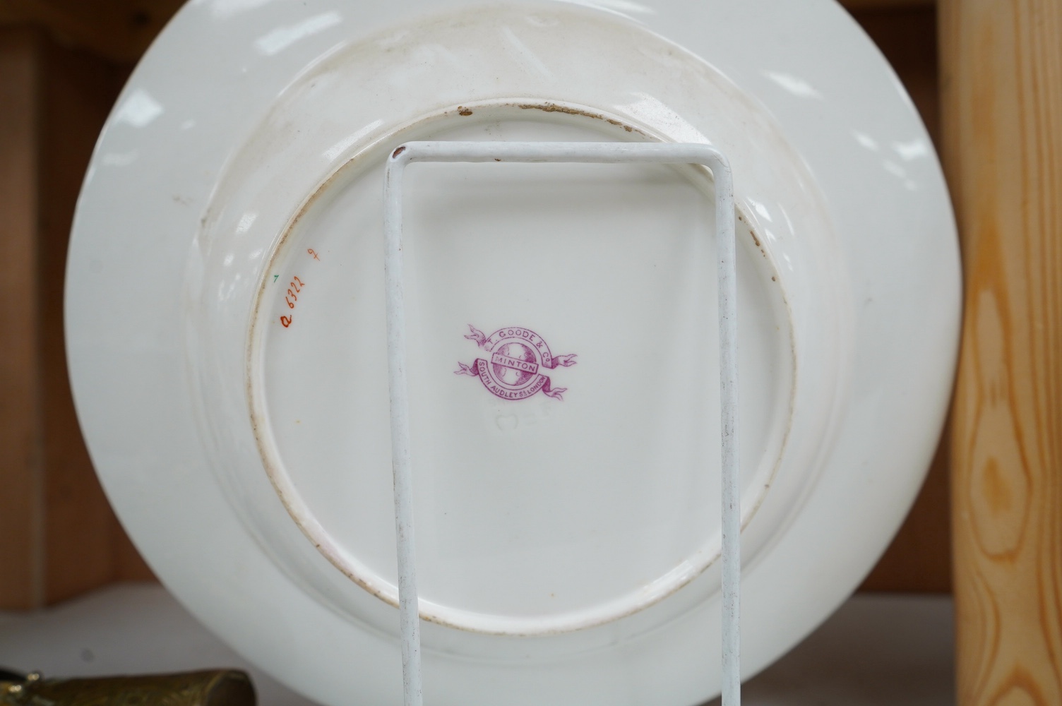 A pair of Minton armorial porcelain soup dishes with Latin motto, 25cm in diameter. Condition - good